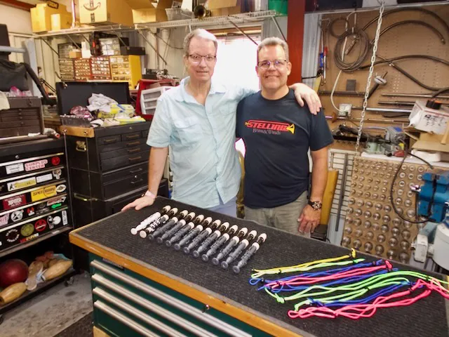 Dr. nabb and jeff stelling stand in front of a table with assembled recorders