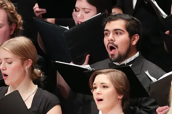 a student performs in a choir
