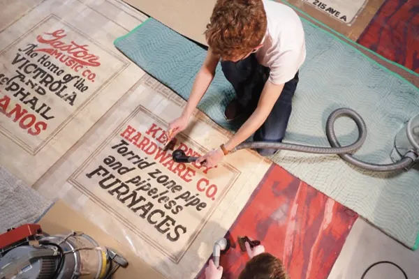 a student works restoring historic prints