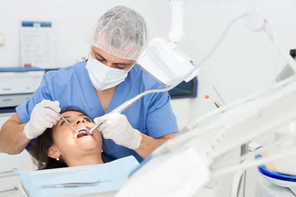 a Dentist works with a patient