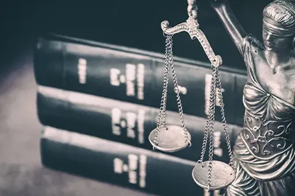 scales of justice next to books