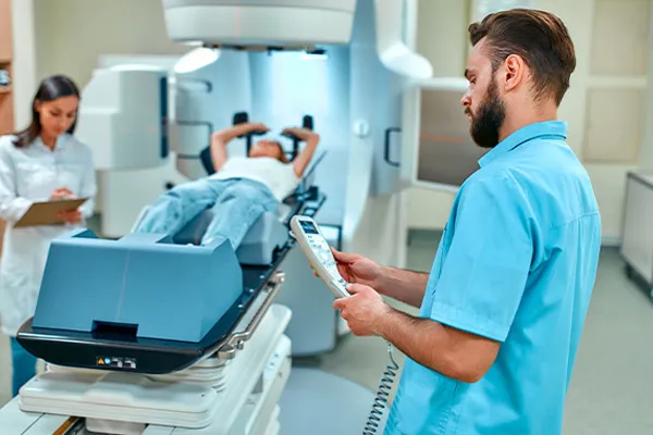 a radiologic technologist works with a patient