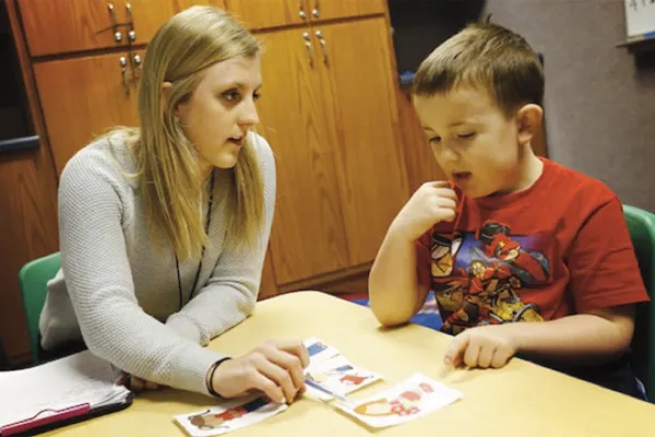 a teacher works with a student