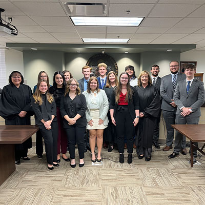 image of klop students with judges in a courtroom