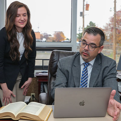 image of a political science alumni helping a pre-law student