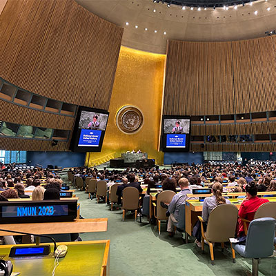 image of students at model United Nations event listening to a speaker