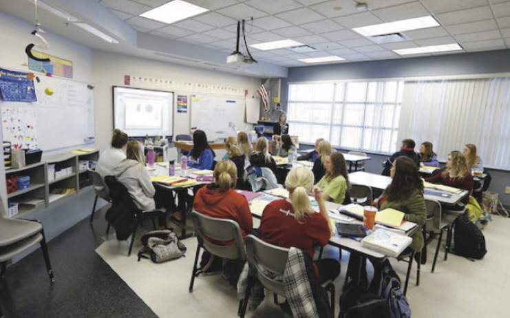 students observe a teacher