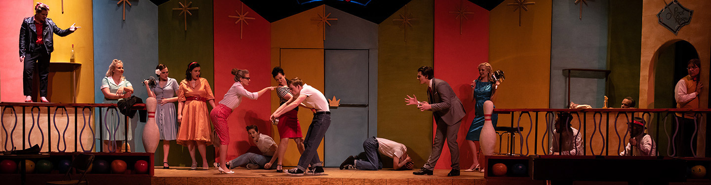 Students performing in a theatre show 5 Women