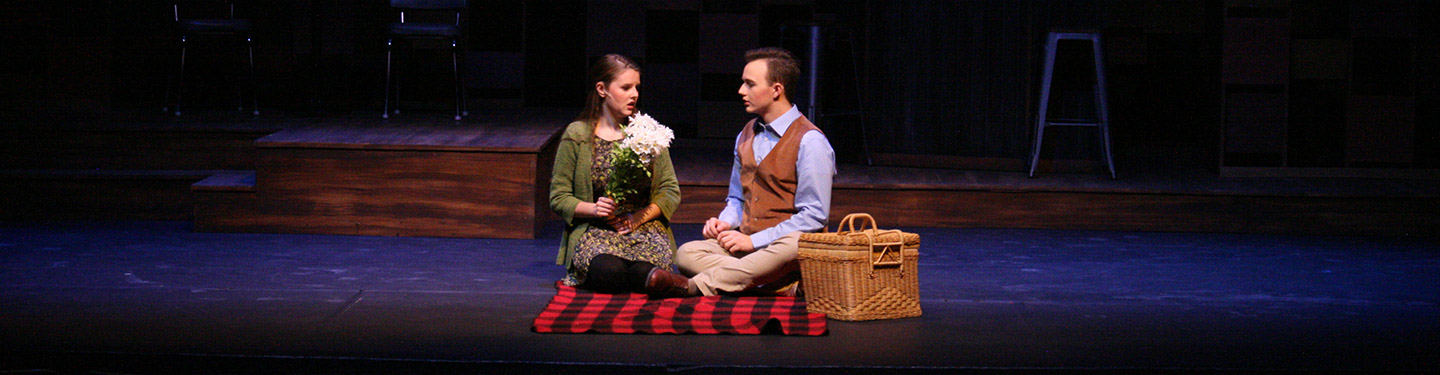 Students performing in a theatre show Rashomon