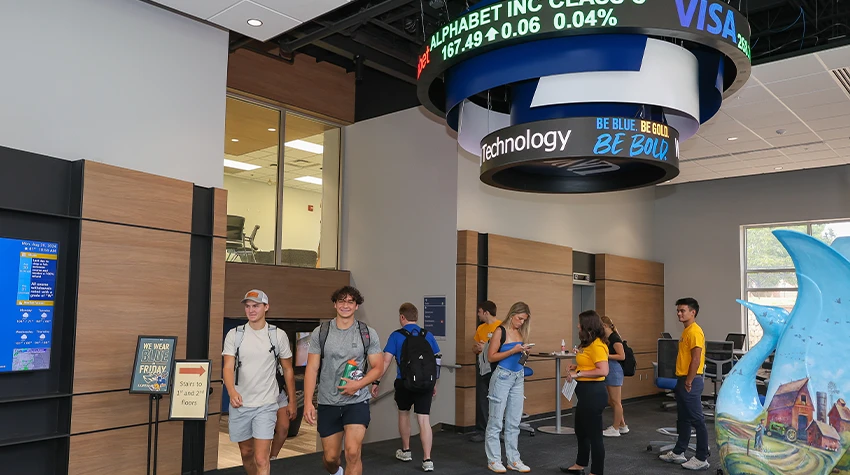 student gather in the lobby of west center