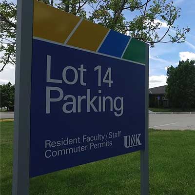 a parking lot sign at unk