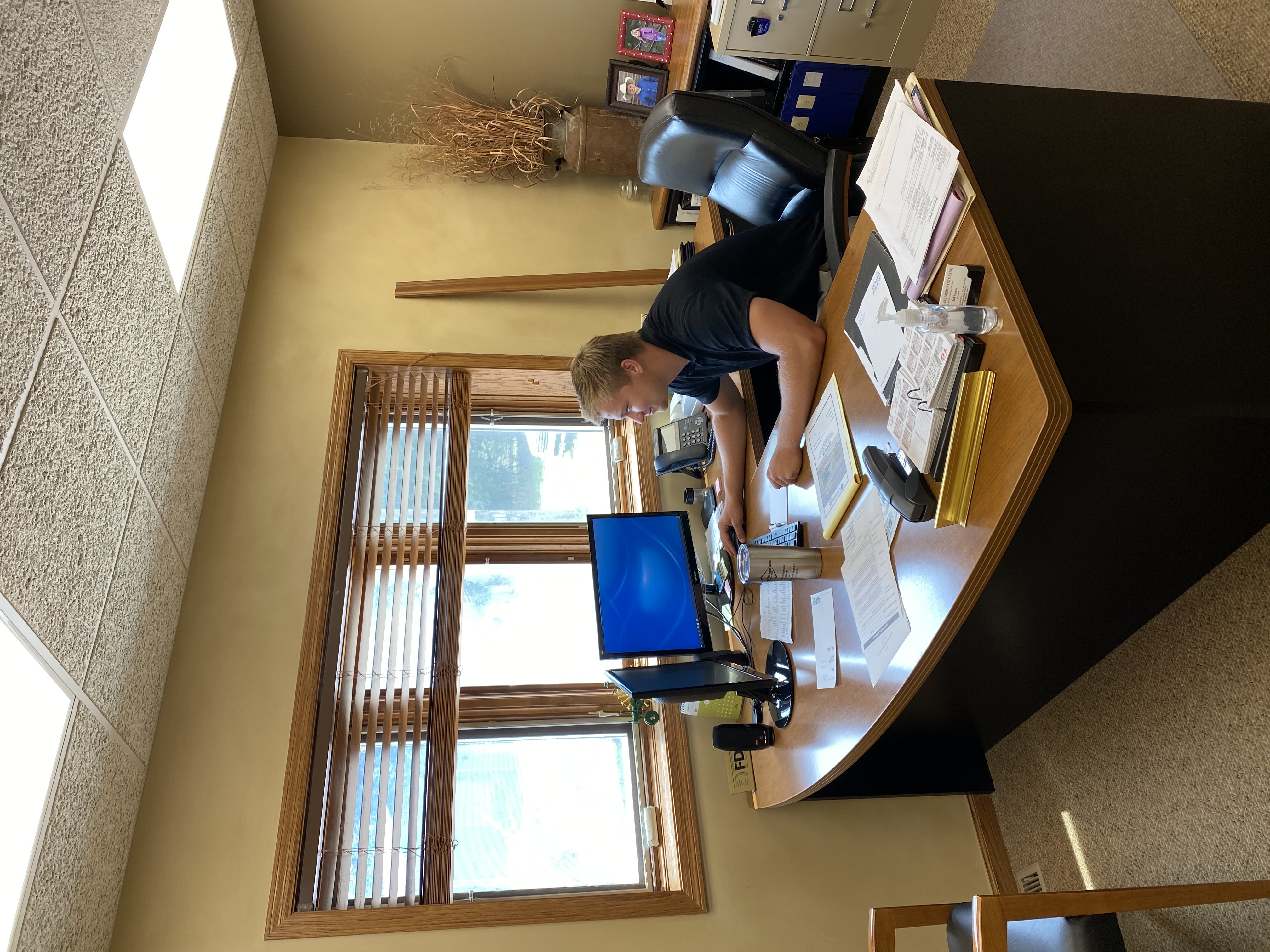 Trevor Luzum at a desk