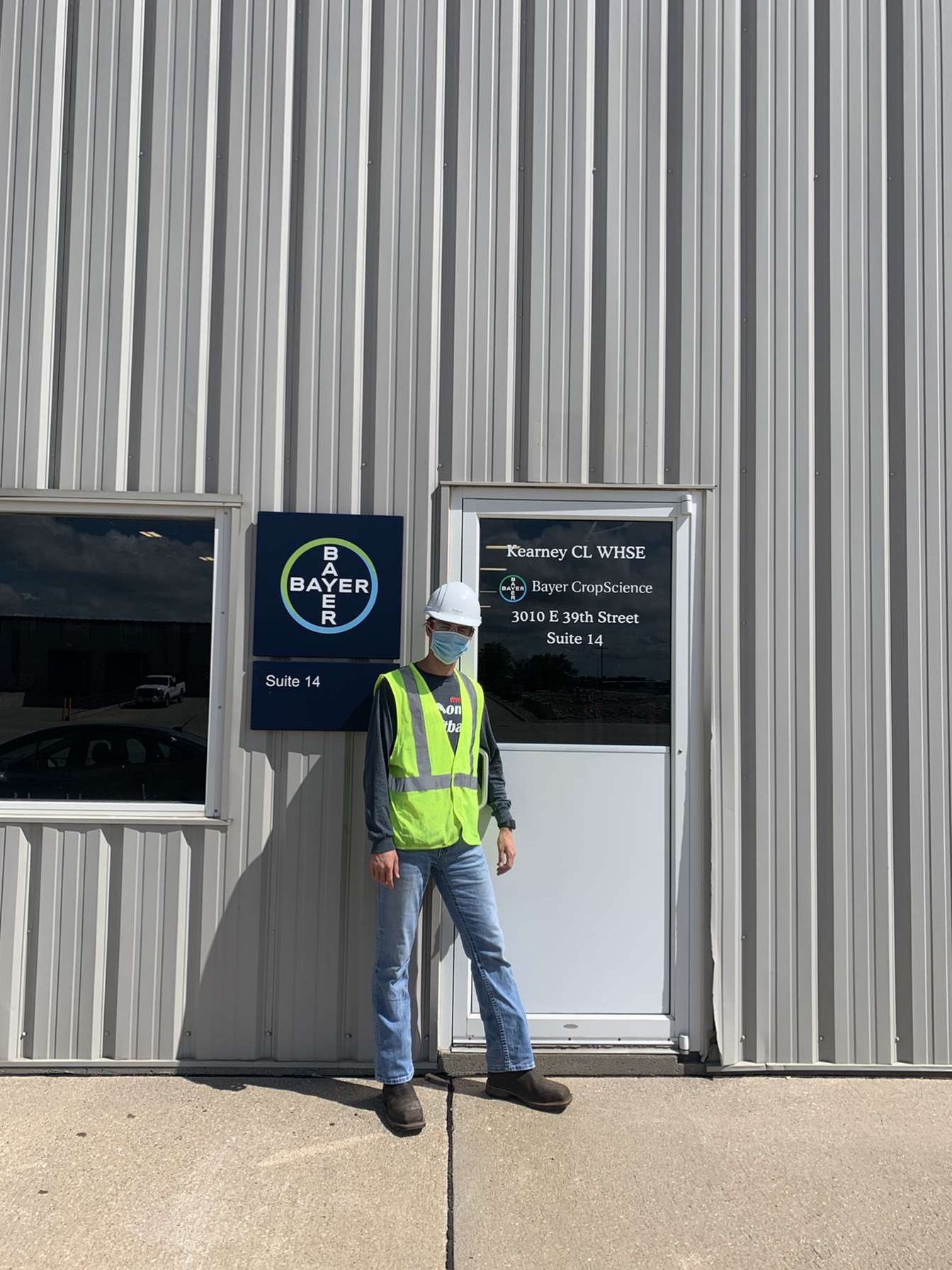 Trevor Matousek standing in front of business