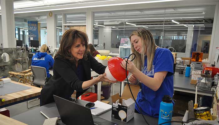 Dana with IDP student in a lab