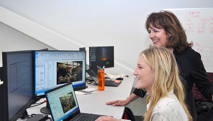 Dana with IDP student in a computer lab