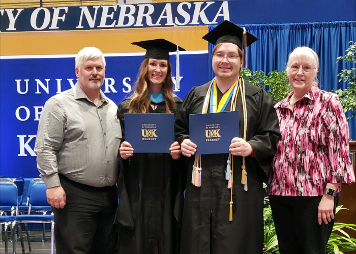 Kelsey Walker posing with her family at graduation