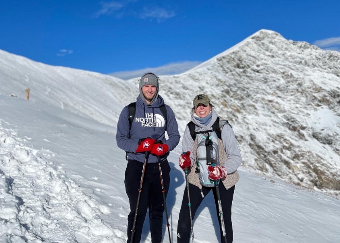 bucci hiking in the mountains in the snow