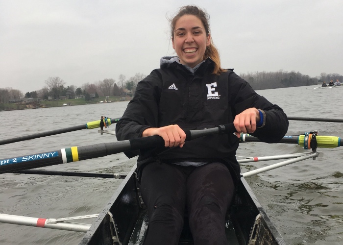 Woman rowing boat.