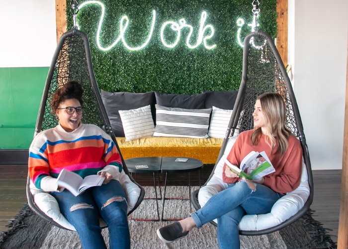 Two girls reading in chairs