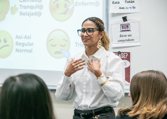 Spanish teacher at front of classroom