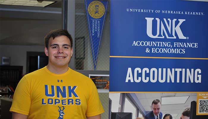 Zeke in front of the Accounting Department 