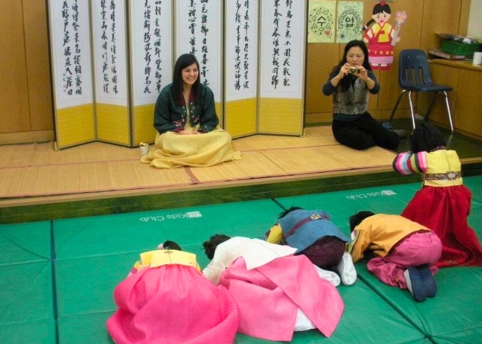 Young Korean students participating in Lunar New Year traditions.