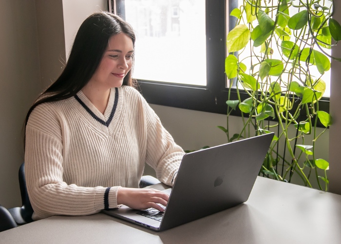 Woman sitting at computer.