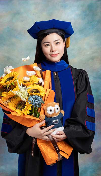 Dr Li in graduation robes