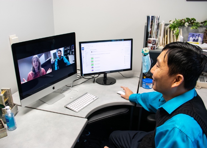 Professor on video call with student.