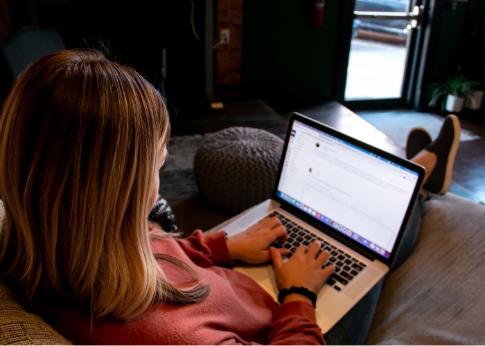 Woman using laptop.