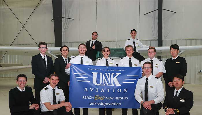 Group Picture in front of airplane