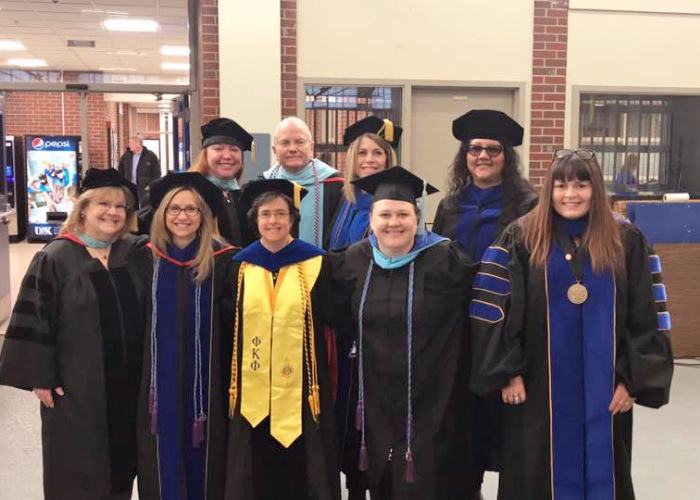 tcp faculty in commencement robes