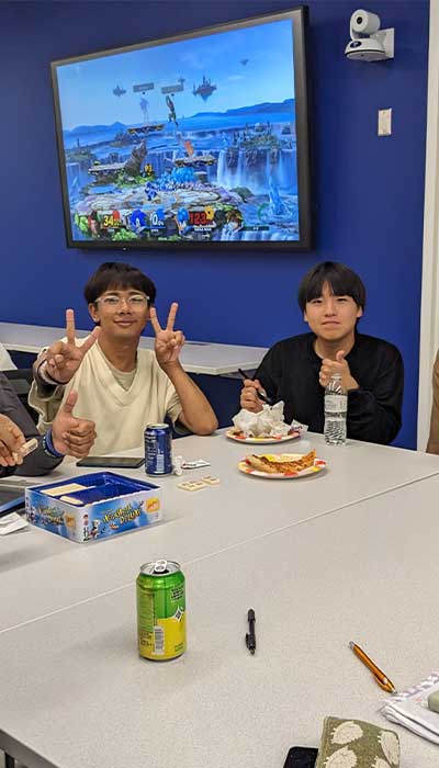 Students playing a game during a weekly meeting