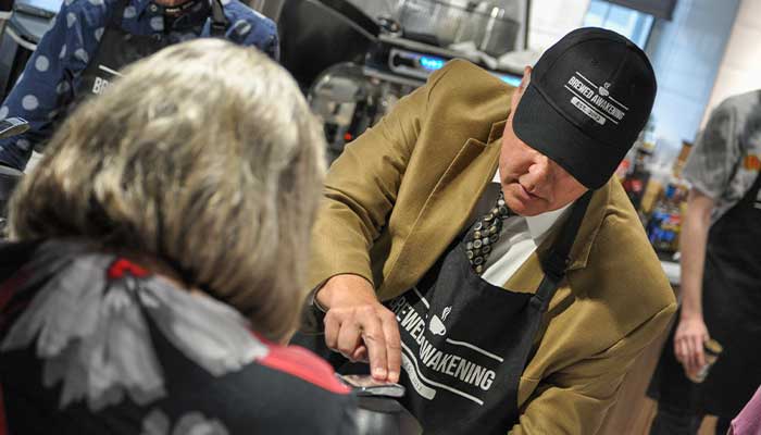 dean jares serving coffee at brewed awakening