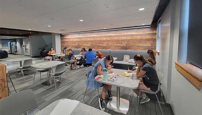 students working on a project during a meeting