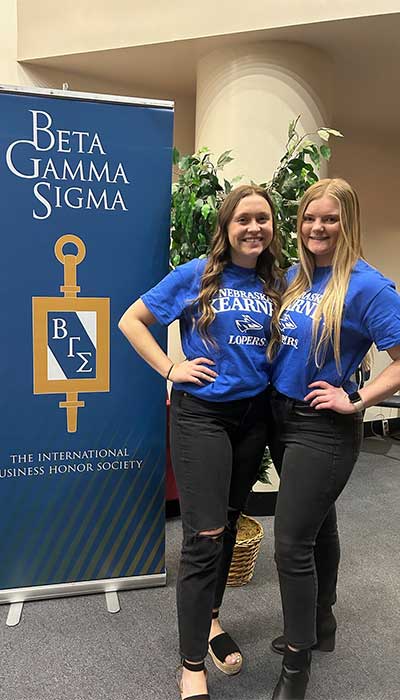 Shayli and Emily in front of BGS Sign