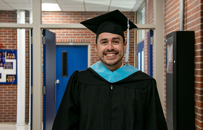 John Kretlow in his graduation regalia during UNK's winter 2024 commencement ceremony.