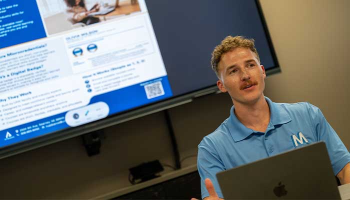 Nathan giving presentation on UNK Advance