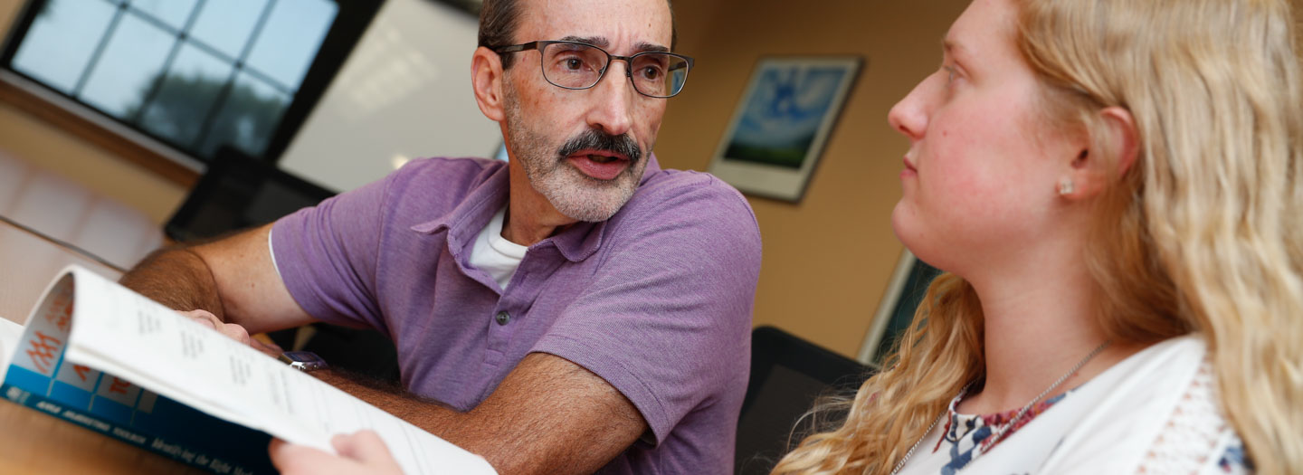 UNK faculty helping student