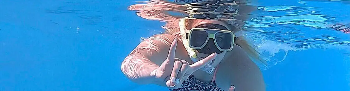 study abroad student swimming in the ocean