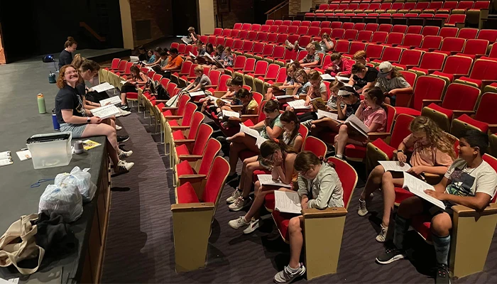 students sit in an auditorium
