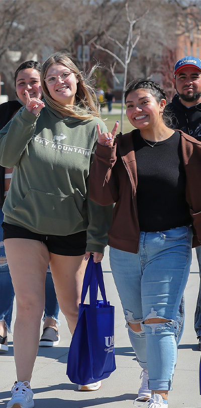 students walk across campus