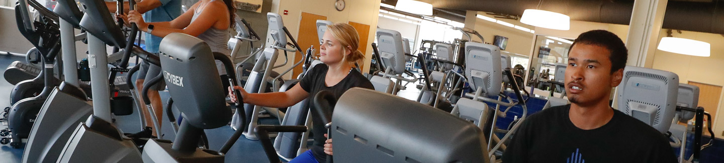 Students on Treadmills and excercise equipment in the Wellness Center