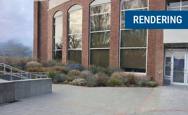Brick building exterior with tall arched windows and landscaped plants along a concrete walkway, with a "RENDERING" label in the top right.