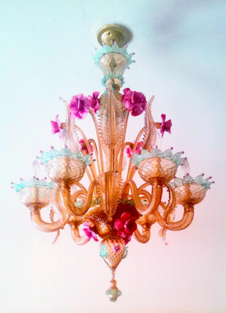 Made in Murano, Italy, this chandelier dates to the 1920s and is made of hand-blown glass.