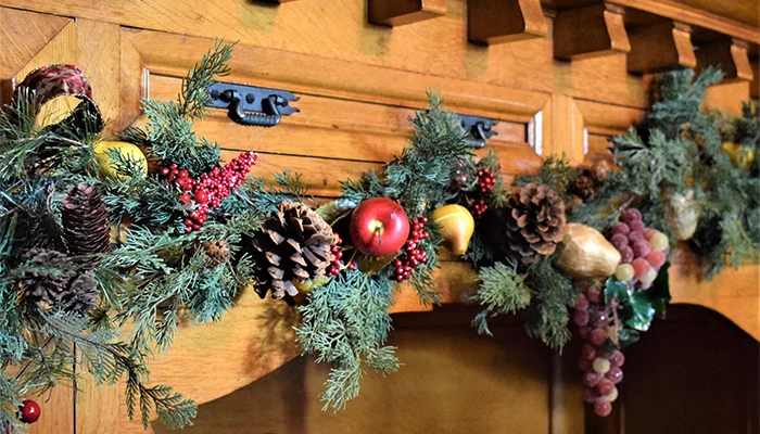 holiday decorations on a mantle in the frank house