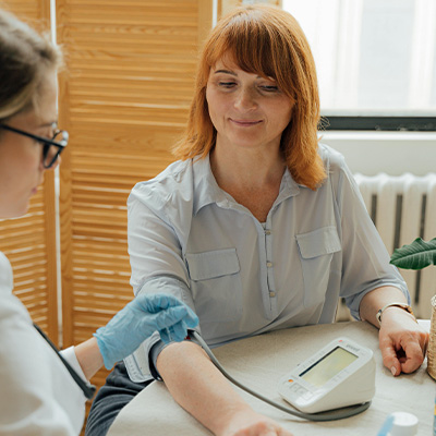 a woman getting a blood pressure check