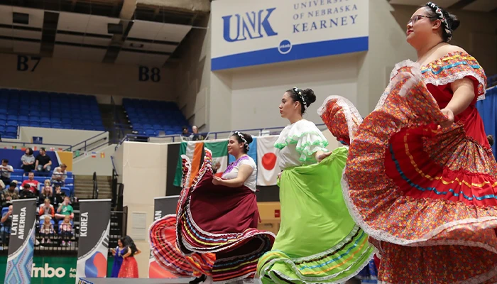 students put on a dance presentation at the international food festival event