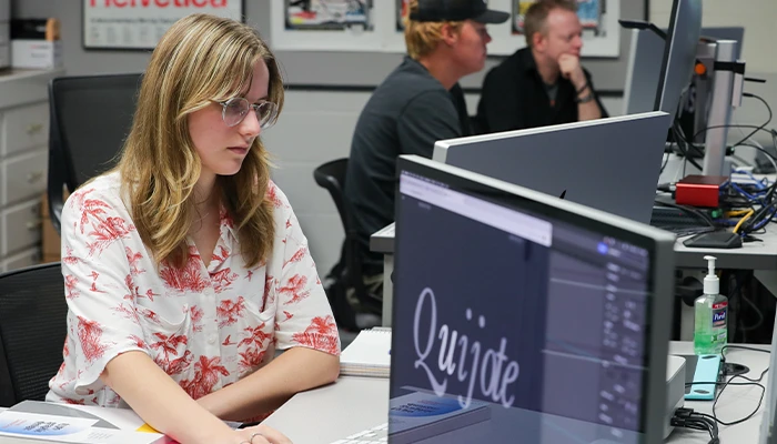 a student works at a computer in class