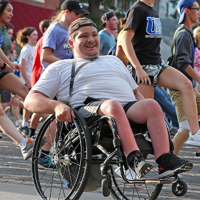 a student in a wheelchair participates in a student parade